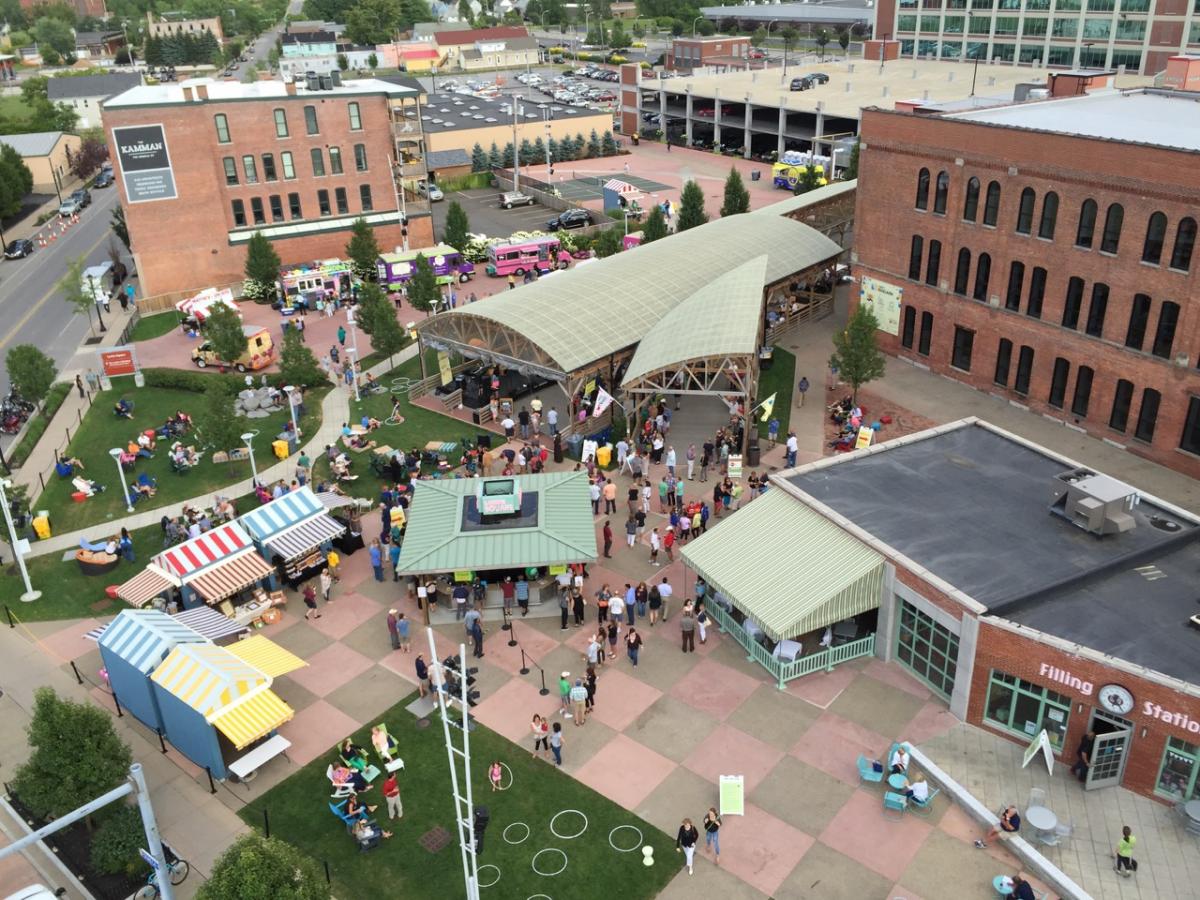 An aerial of Larkin Square shows public spaces, the performance pavilion, food stands, and other areas of activity.