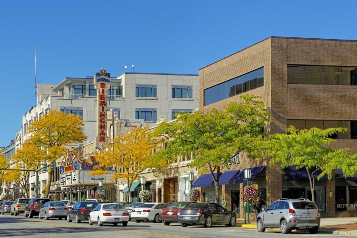 Mixed-use buildings flank the old Birmingham theater. Photo by Carroll DeWeese