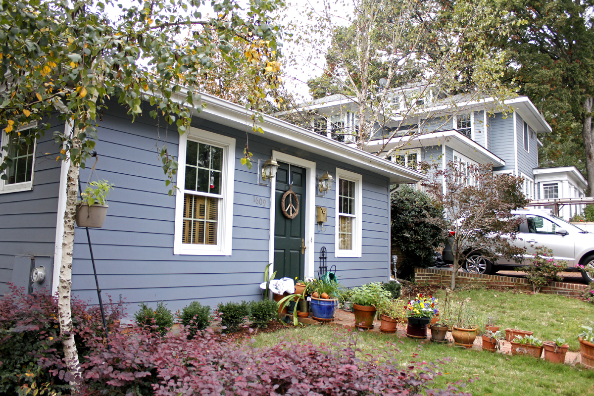 Small blue home next to larger blue home